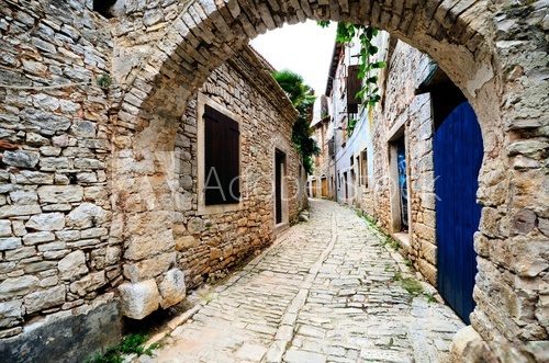 Fototapeta Ancient arched medieval street in an old village in Istria, Croatia