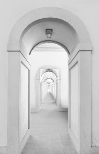 Fototapeta Endless arched doorways repeating to infinity