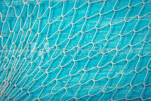 Fototapeta Fishing net over blue background