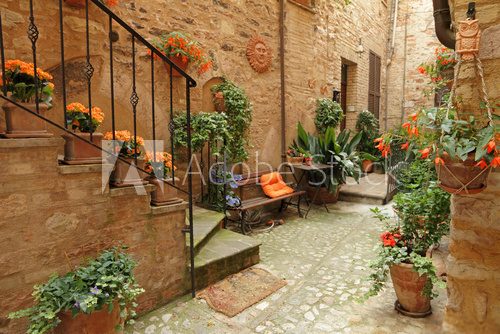 Fototapeta italian patio with flowers , Spello, Umbria