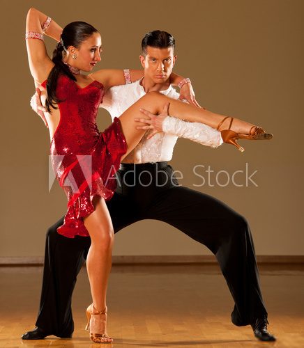 Fototapeta latino dance couple in action - dancing wild samba