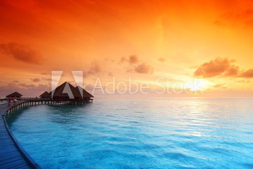 Fototapeta maldivian houses on sunrise