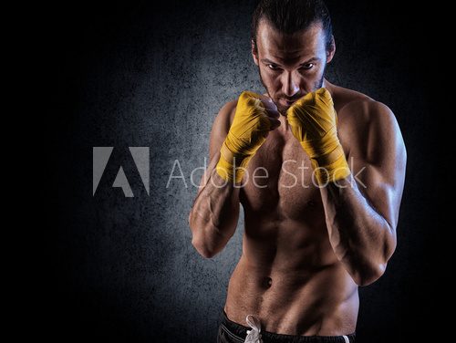 Fototapeta man wearing boxing gloves