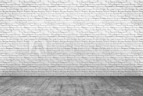 Fototapeta pavimento in cemento e muro in mattoni bianchi
