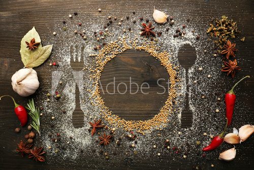 Fototapeta Spices on table with cutlery silhouette, close-up
