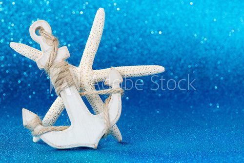 Fototapeta white anchor and starfish in the seabed