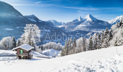 Fototapeta Winter wonderland in the Alps with mountain chalet