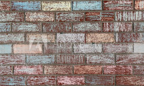 Fototapeta A brick wall at a school covered with colored chalk..