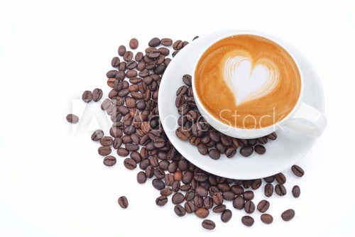 Fototapeta A cup of cafe latte and coffee beans on white