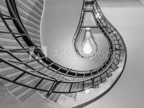 Fototapeta Abstract shot of a staircase leading towards a light bulb like o
