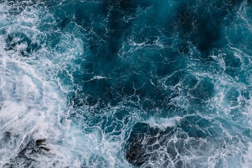 Fototapeta Aerial view to ocean waves. Blue water background