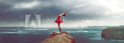Fototapeta Ballet Dancer in front of a stormy sea landscape