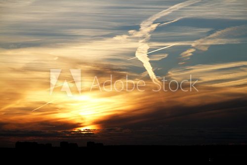 Fototapeta beautiful red-golden sunset with a cloudy bird