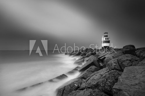 Fototapeta Black and white picture and long exposure of the lighthouse in Ijmuiden.