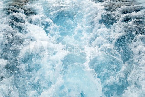 Fototapeta blue sea water with white foam, abstract nature background