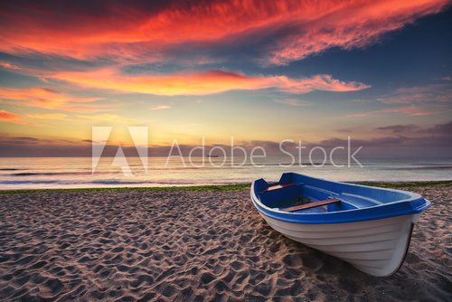 Fototapeta Boat and sunrise