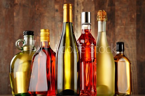 Fototapeta Bottles of assorted alcoholic beverages