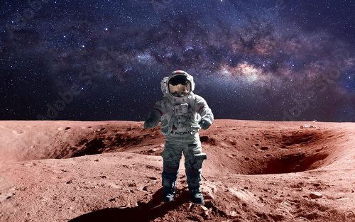 Fototapeta Brave astronaut at the spacewalk on the mars. This image elements furnished by NASA.