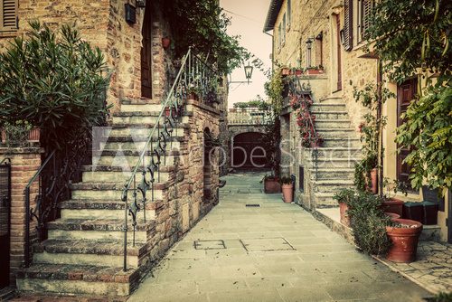 Fototapeta Charming old medieval architecture in a town in Tuscany, Italy.