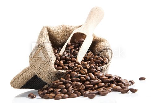Fototapeta coffee beans in bag with wooden spoon.