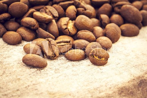 Fototapeta Coffee beans on wooden background