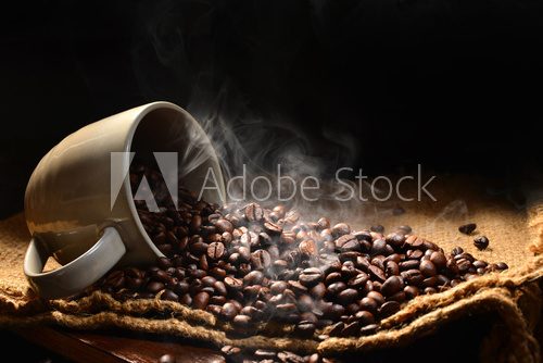 Fototapeta Coffee beans with smoke in coffee cup