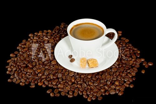 Fototapeta Coffee cup and coffee beans isolated on black background