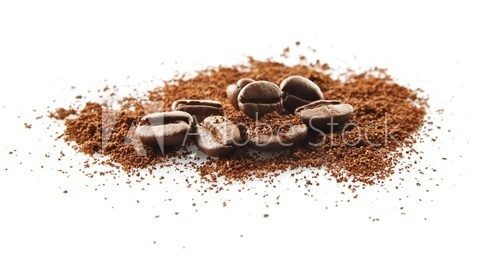 Fototapeta Collected coffee beans with coffee powder on white