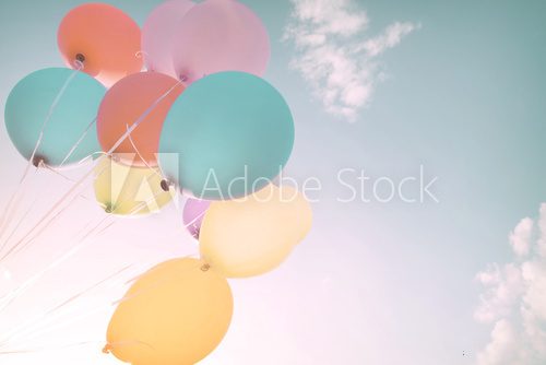 Fototapeta Colorful balloons in summer holidays. Pastel color filter