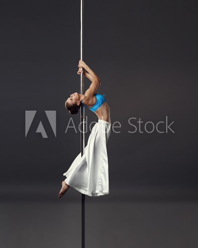 Fototapeta Concept of strength and beauty. Sexual pole dance