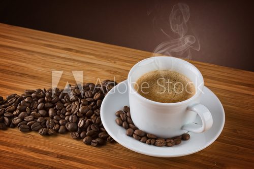 Fototapeta cup of coffee on brown background