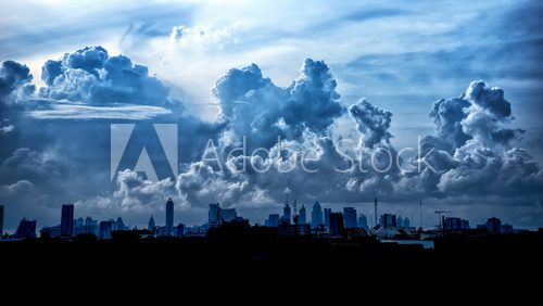 Fototapeta Dark blue storm clouds over city in rainy season