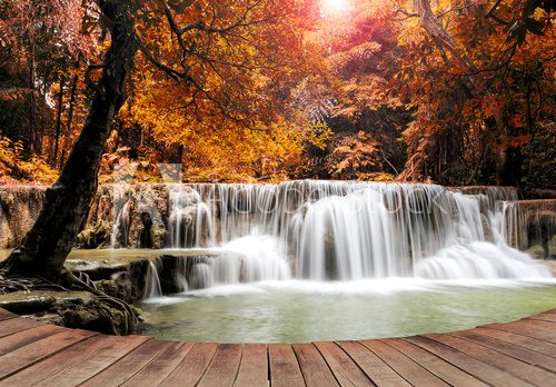 Fototapeta Dreaming of water fall on a empty wooden pier