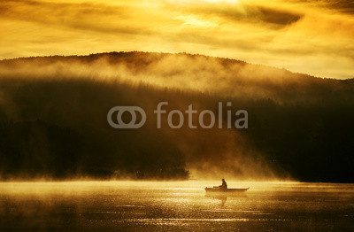 Fototapeta Early morning sunrise, boating on the lake in the sunlight