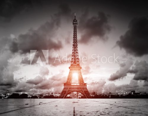 Fototapeta Effel Tower, Paris, France. Black and white with red sun light
