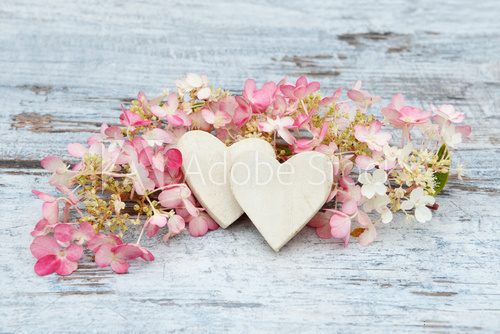Fototapeta flower and wooden heart lying on wood