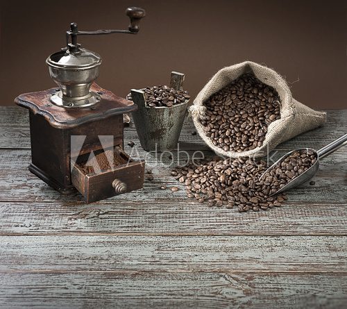 Fototapeta Fresh roasted coffee beans in burlap sack. 