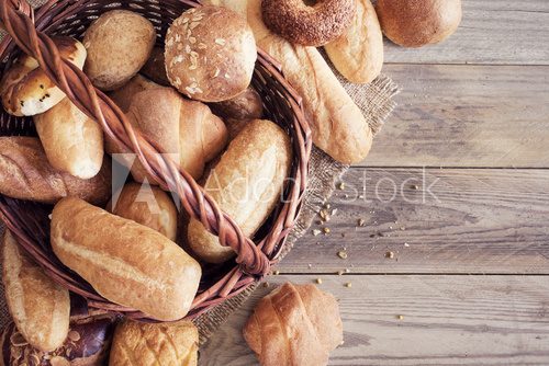 Fototapeta Freshly baked bread on wooden table