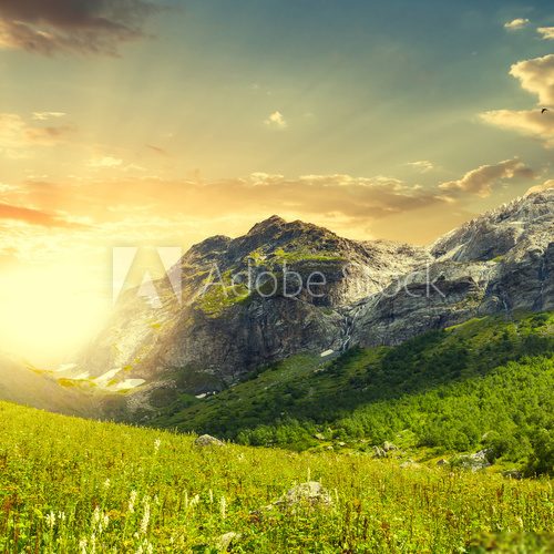 Fototapeta green mountains at the sunset