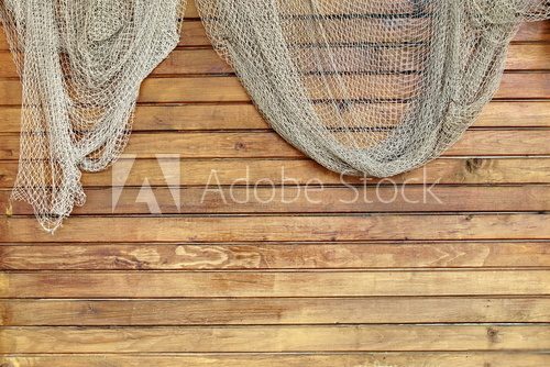 Fototapeta Hanging Fishnet on Rustic Wood Wall