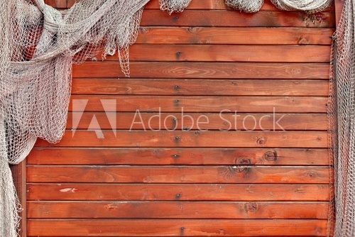 Fototapeta Hanging Fishnet on Wood Wall