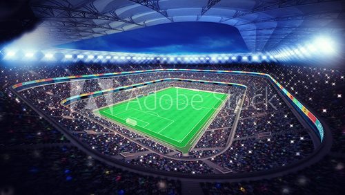 Fototapeta illuminated football stadium with fans in the stands