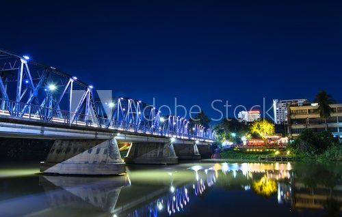 Fototapeta Iron bridge At twilight time Chiangmai in Thailand , With Lens Flare