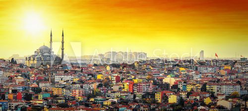 Fototapeta Istanbul Mosque with colorful residential area in sunset