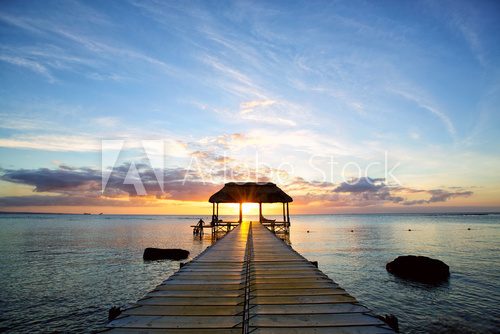 Fototapeta Jetty silhouette against beautiful sunset in Mauritius Island
