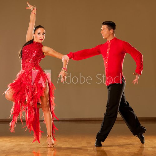 Fototapeta latino dance couple in action - dancing wild samba
