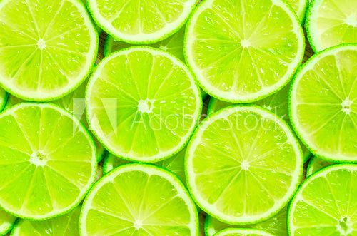 Fototapeta Lime slices background
