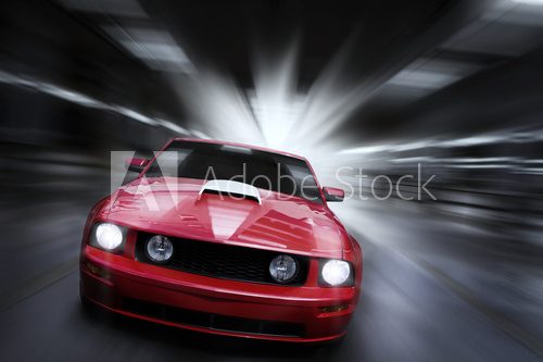 Fototapeta Luxury red sport car speeding in a underground parking