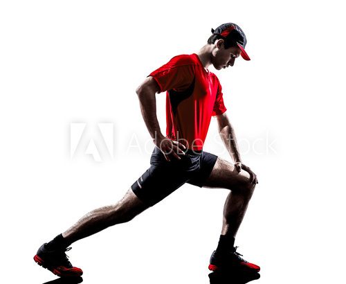 Fototapeta man runner jogger stretching warming up silhouette
