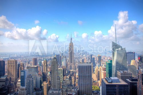 Fototapeta Manhattan Skyline with a cloudy sky